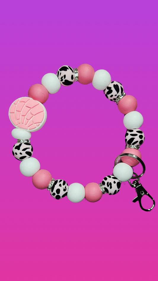 PINK CONCHA AND COW PRINT WRISTLET KEYCHAIN